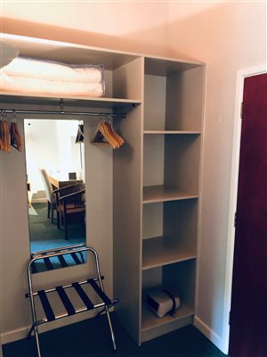 open shelves hanging space luggage rack